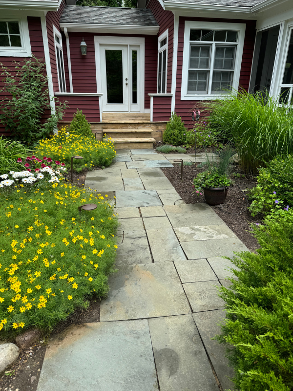 Beautifully maintained pathway and garden enhancing curb appeal in La Porte.